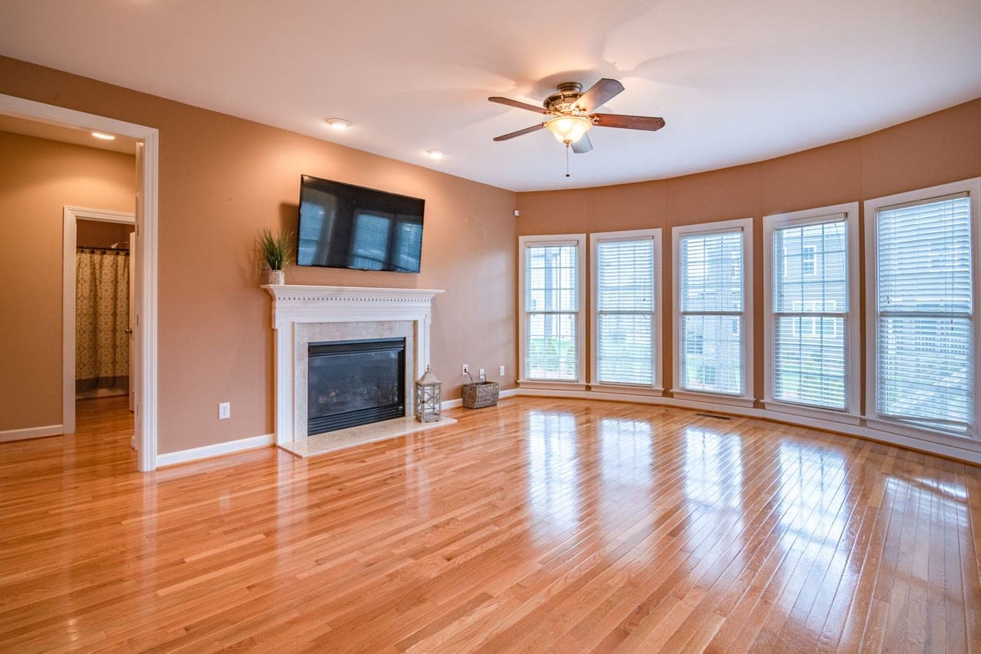 Living room with warm hardwood-style flooring