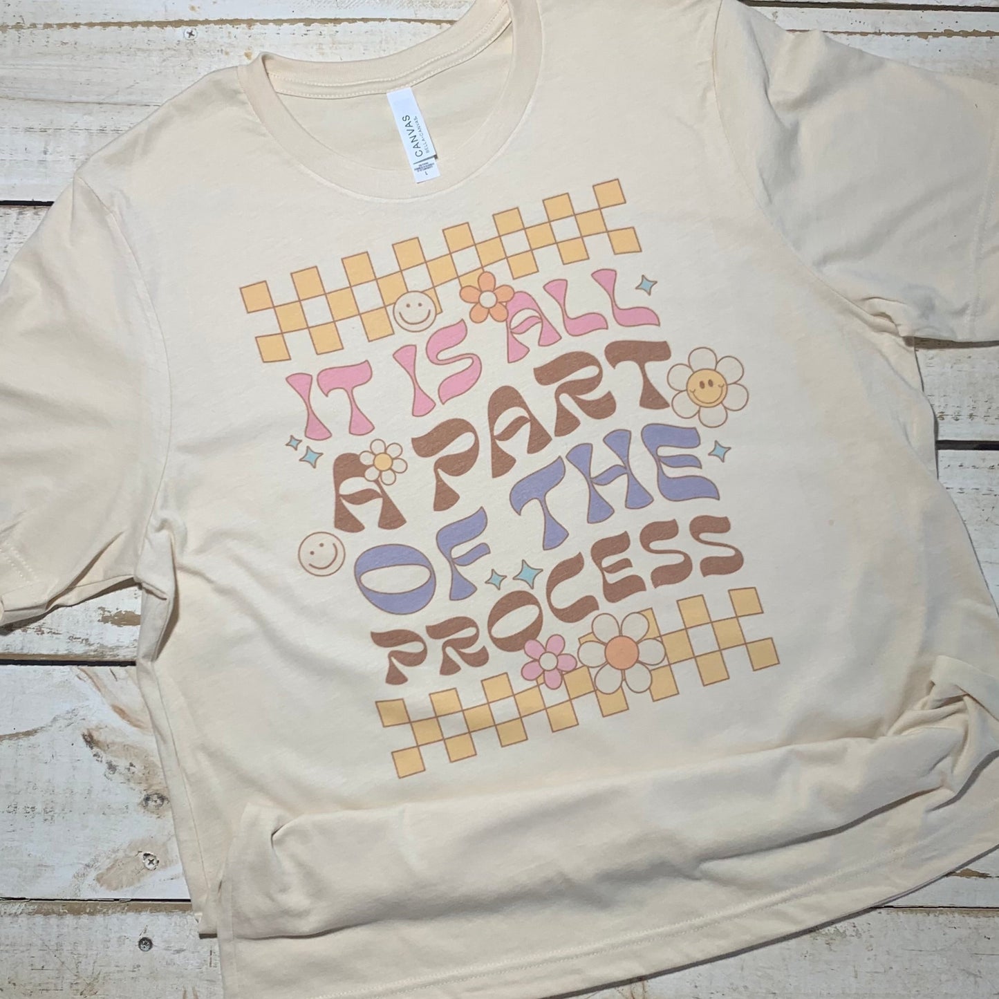 "Teacher shirt featuring the words 'Part of the Process' on a Bella-Canvas Heather Soft Cream background. Perfect for educators who value comfort and style in their daily wardrobe. 🍎📚 #TeacherStyle #BellaCanvasFashion"