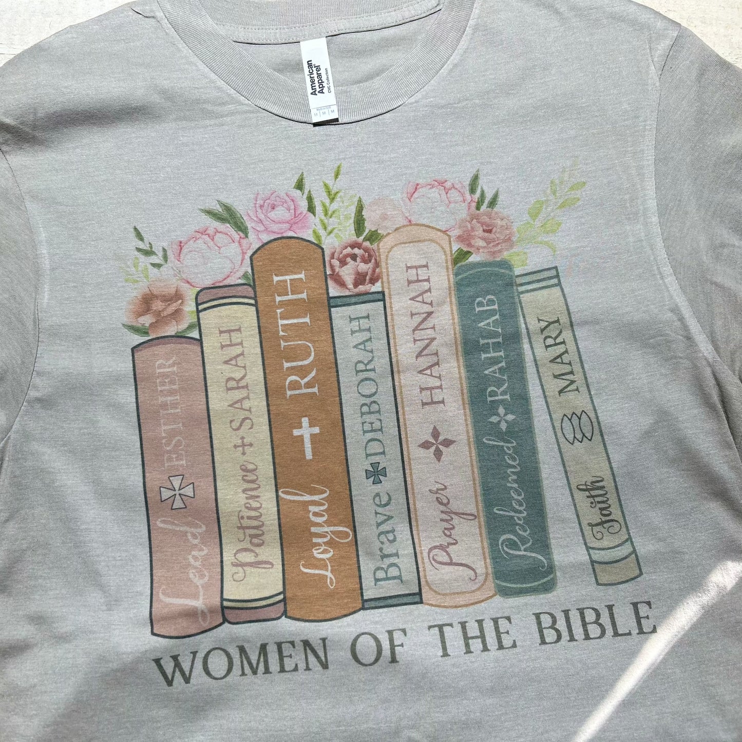 "Khaki T-shirt featuring a stylish 'Woman of the Bible' design from Red Oak Trading Company's Faith Collection, honoring the strength and faith of biblical women."