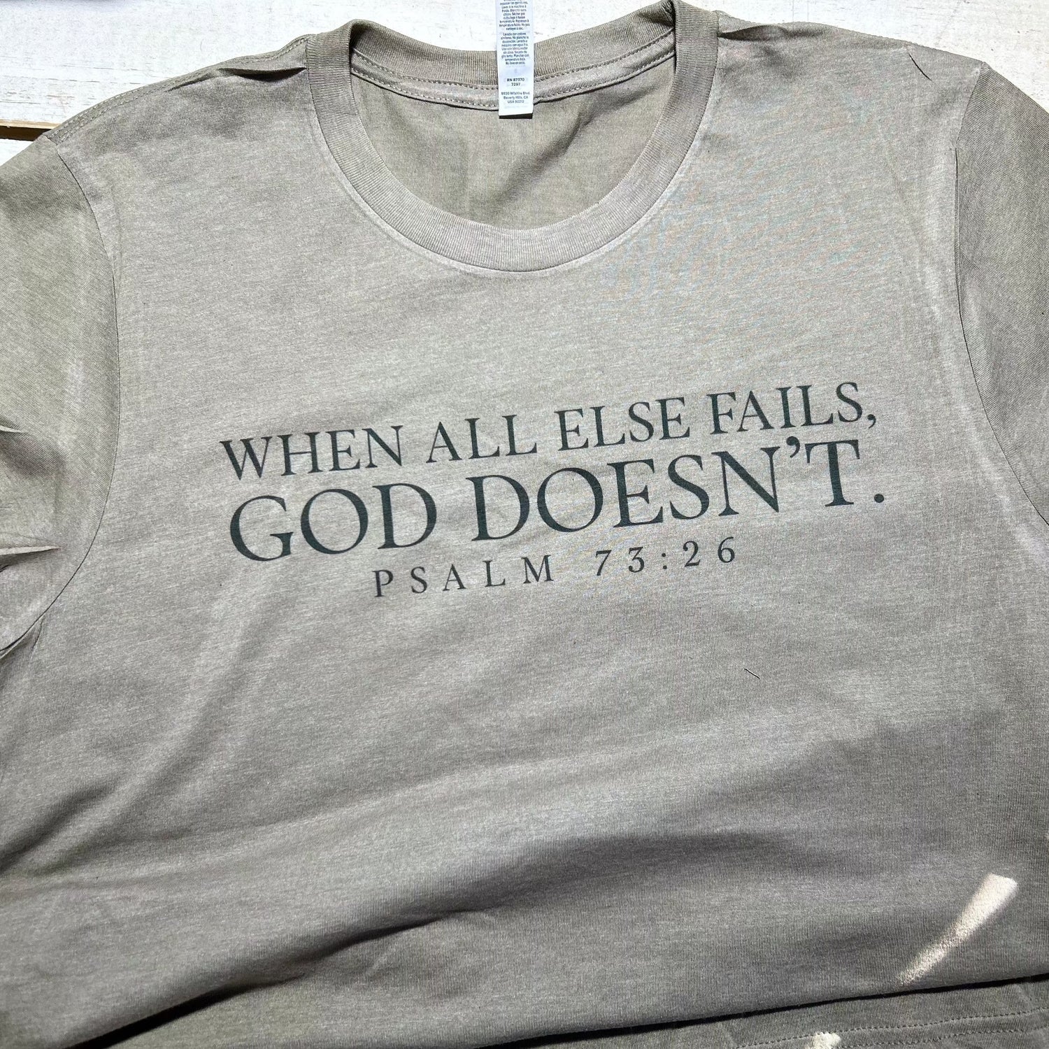 Red Oak Faith Collection T-shirt in olive with Psalm 73:26 scripture - "When All Else Fails, God Doesn't."