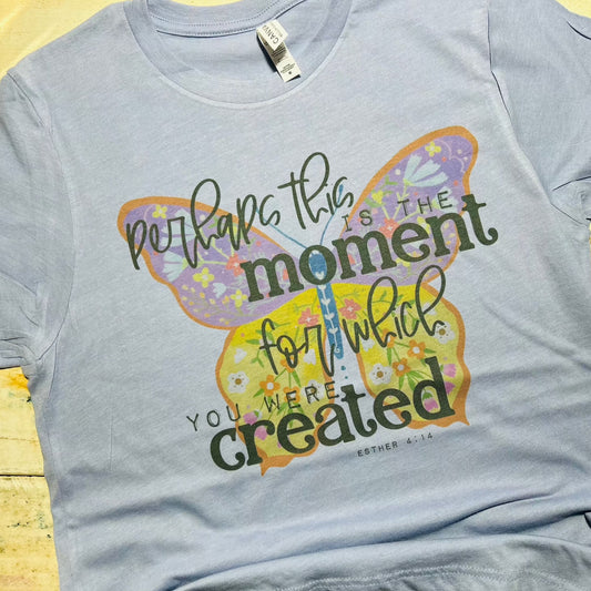 "Red Oak Trading Company Faith Collection T-shirt featuring the empowering phrase 'Perhaps This is the Moment' in stylish print, promoting positivity and timeless style."