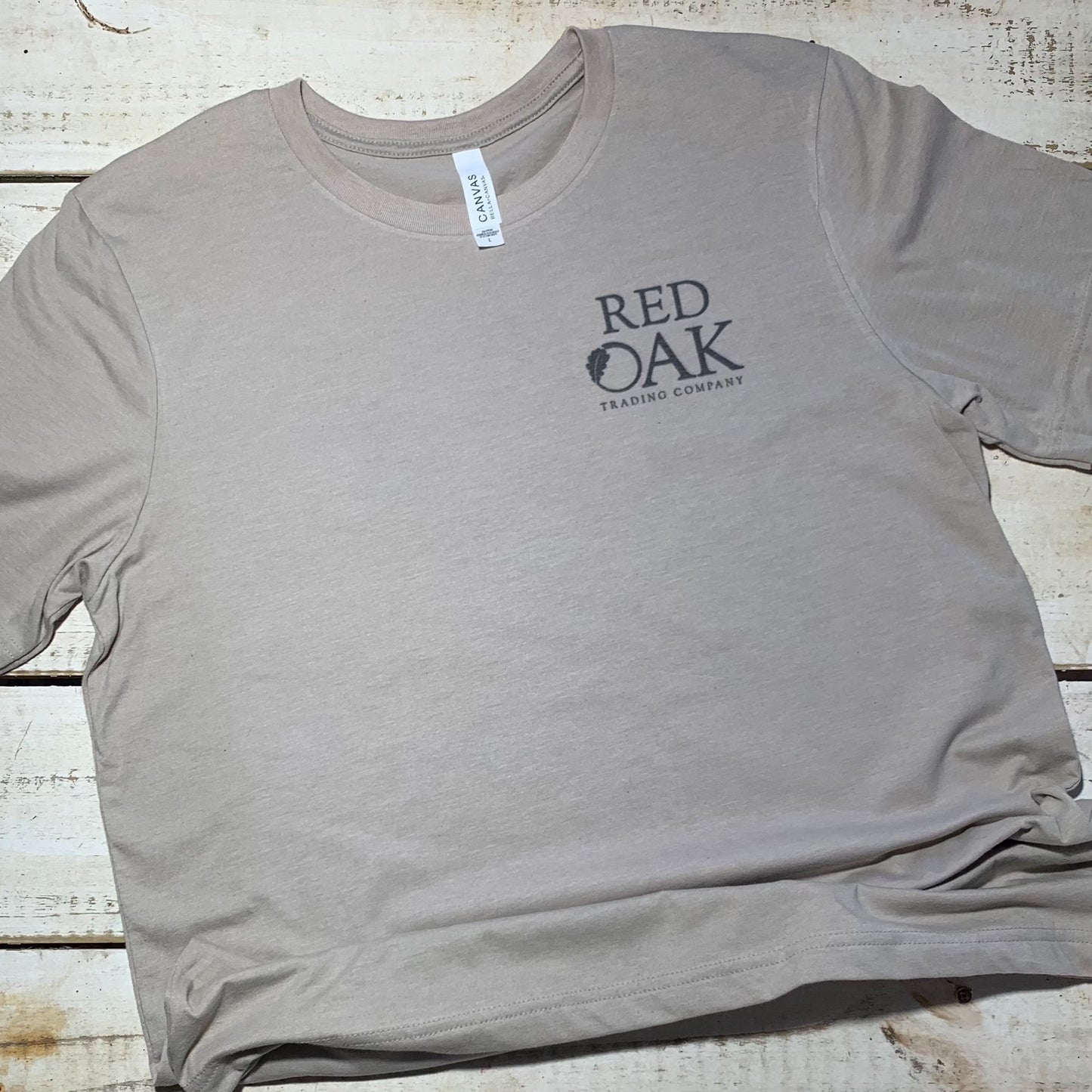 Stunning Red Oak Quail design on a Bella-Canvas heather tan t-shirt from the Backyard to Backwoods Apparel collection. Celebrate nature's beauty with this stylish and comfortable tee, perfect for outdoor enthusiasts and those who appreciate the charm of backyard wildlife.  Front