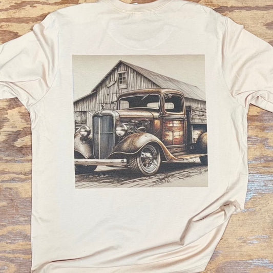 Alt Text: A Bella+Canvas Sand Dune T-Shirt featuring the Red Oak Old Truck design from Backyard to Backwoods Apparel. The illustration showcases a classic truck parked beneath towering red oak trees, evoking a sense of nostalgic charm. The high-quality shirt, made from a blend of combed and ring-spun cotton, offers a comfortable and breathable feel, making it the perfect companion for any adventure, whether in the backyard or deep in the backwoods. Back