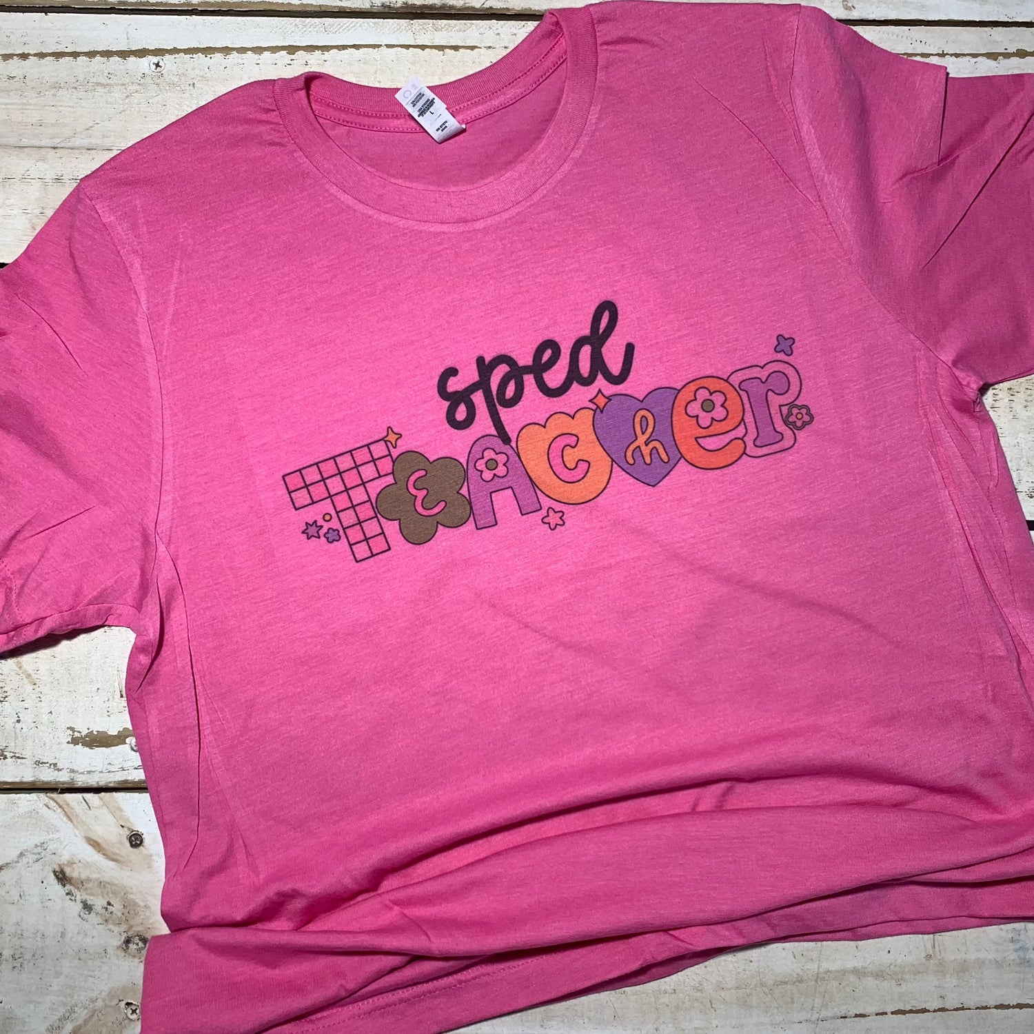 **Alt Text for "Sped Teacher" Shirt Image:**  "Vibrant Bella-Canvas Charity Pink shirt with 'Sped Teacher' print, perfect for passionate educators who teach with heart and dedication. The shirt's design combines style and comfort, making it an ideal choice for teachers in the classroom and beyond."   (Keywords: Sped Teacher, Bella-Canvas Charity Pink shirt, passionate educators, style, comfort, classroom)