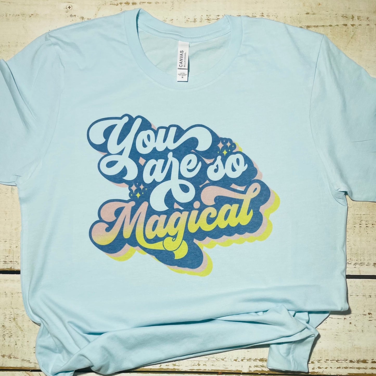 Alt Text for "You Are So Magical" Teacher Shirt:  "Enchanting Bella-Canvas Ice blue shirt featuring the words 'You Are So Magical' in playful font. The design celebrates the magic of teaching and brings positivity to educators' wardrobes."