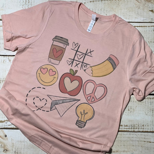 **Alt Text for "Teacher Tic Tac Toe" Shirt Image:**  "Teacher Tic Tac Toe" shirt, Heather Peach Bella-Canvas, perfect for educators of all grades. Unique teacher shirt with Tic Tac Toe game board design featuring X and O symbols, apples, and pencils. Comfortable and versatile, ideal for teacher attire. Vibrant, durable print ensures longevity. Shirt displayed neatly against a clean background. Teacher Shirt, Shirts for Teachers, Teacher Shirts.